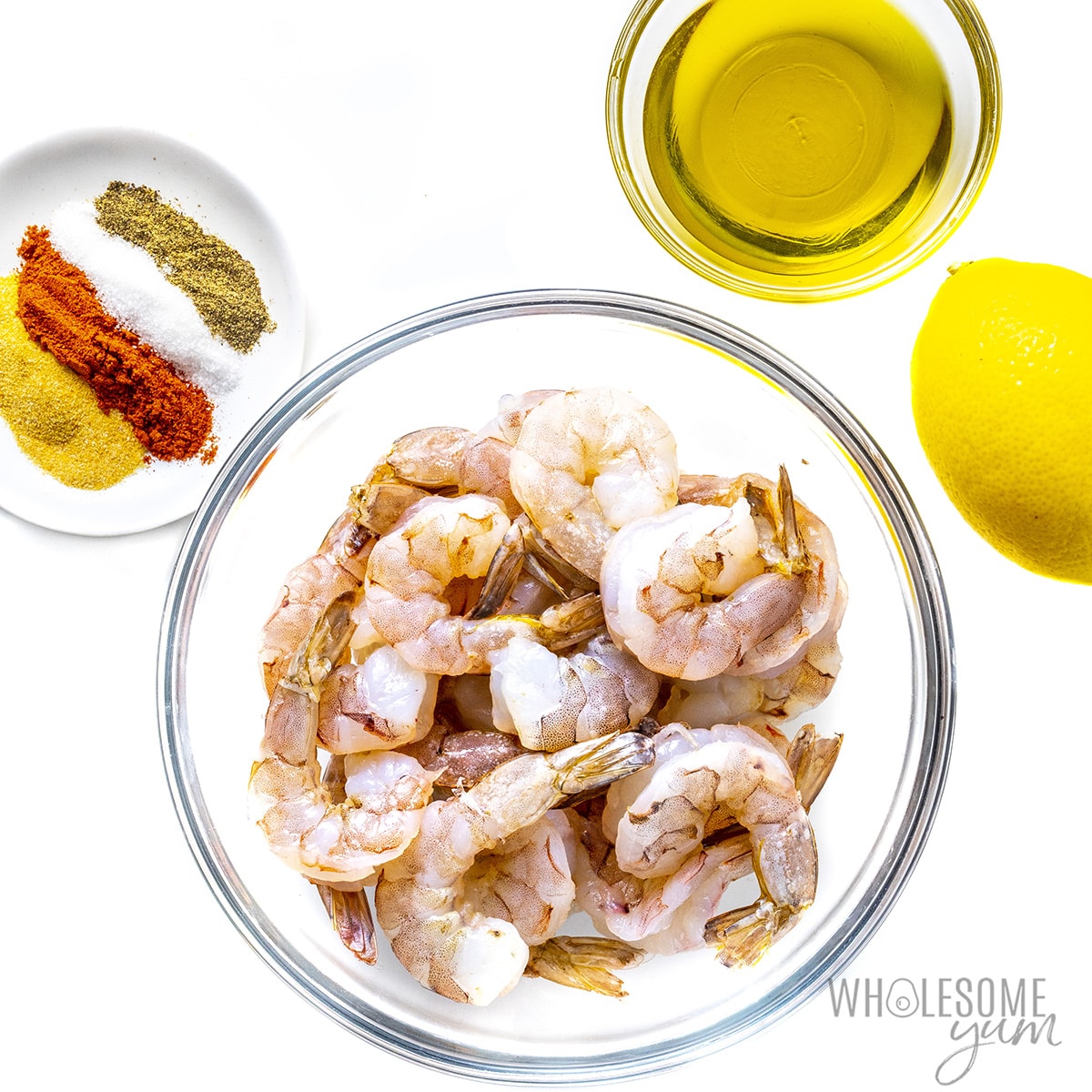 Shrimp and other ingredients in small bowls.