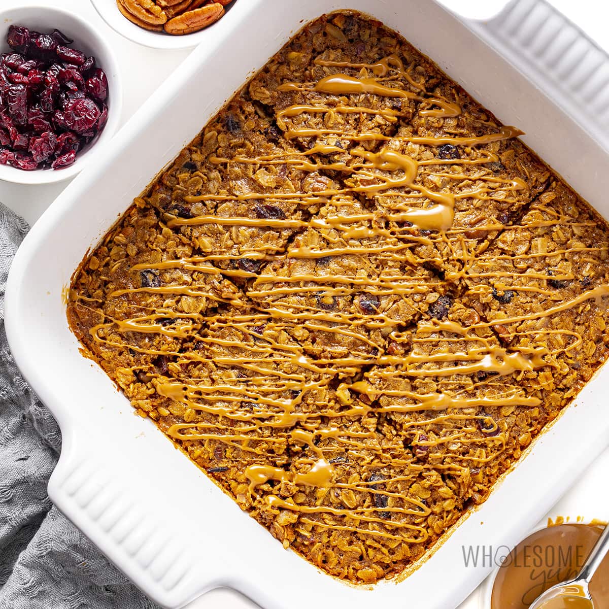 Baked oatmeal recipe with cookie butter drizzled on top.