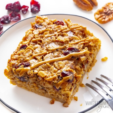 Healthy baked oatmeal slice on a plate with a fork.