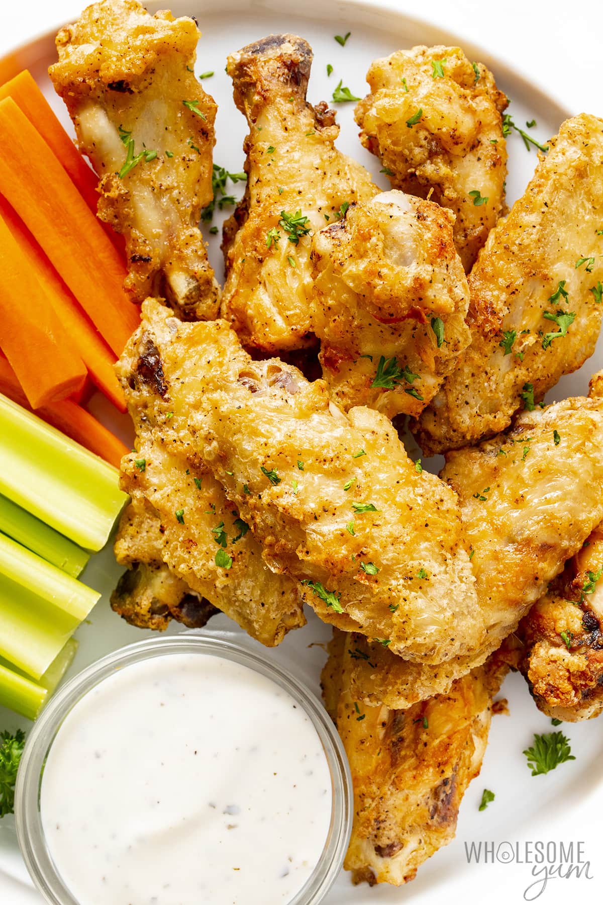 Air fryer frozen chicken wings with carrots, celery, and ranch.