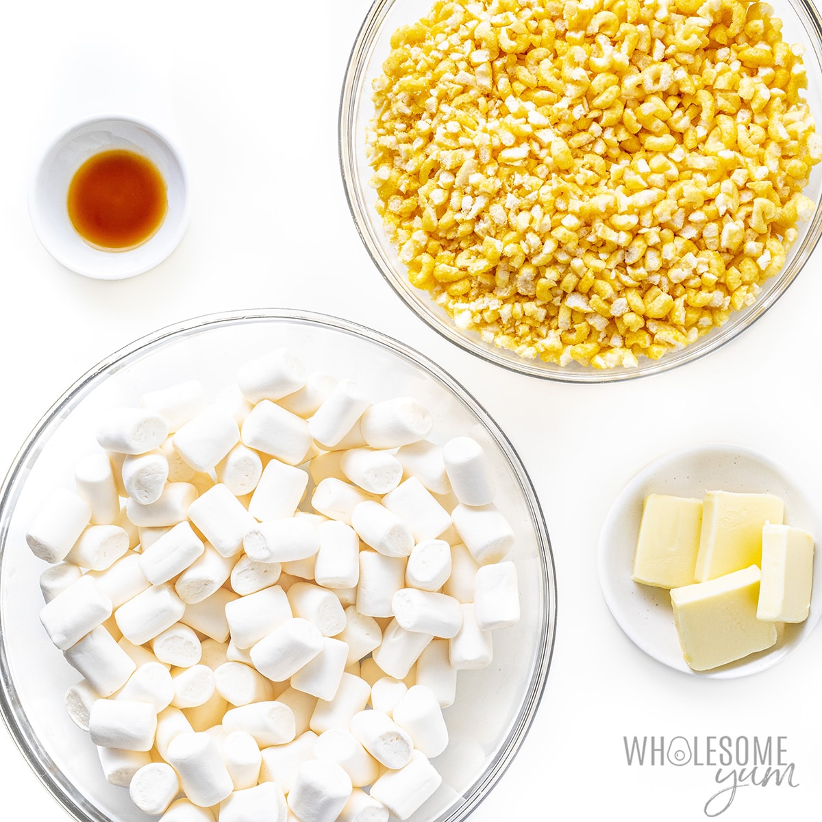 Ingredients for rice krispie treats in small bowls.