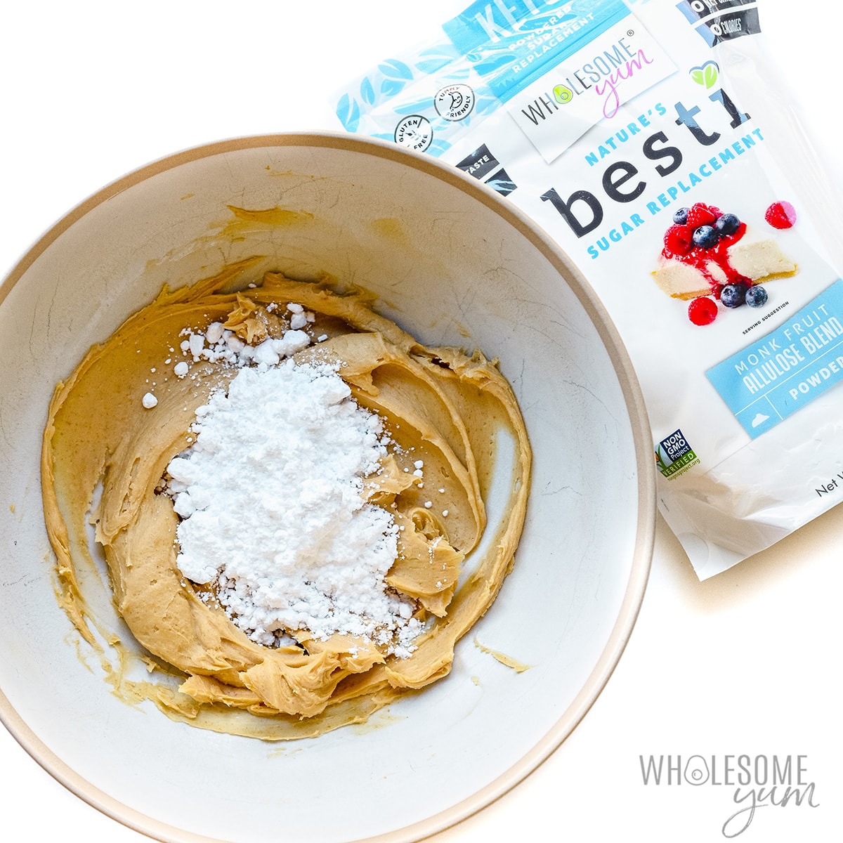 Peanut butter and powdered Besti in a mixing bowl. 