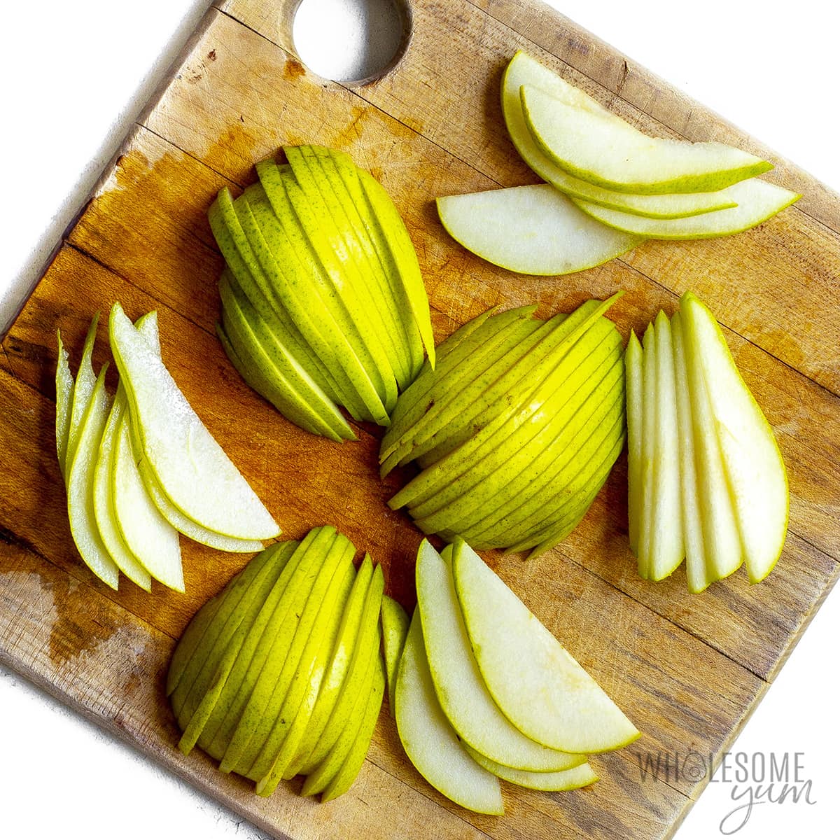 Slices of pears on a cutting board.