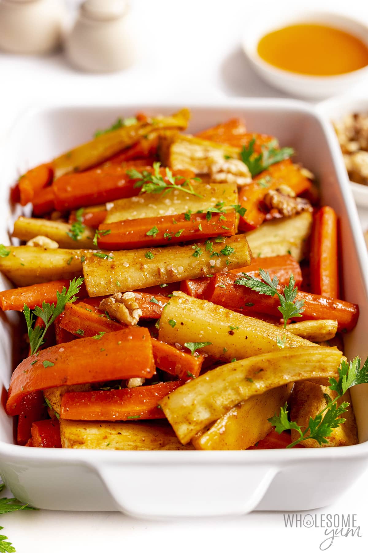 Cooked carrots and parsnips in a serving plater.