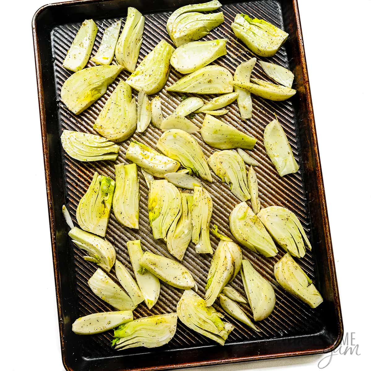 Seasoned fennel on a sheet pan.
