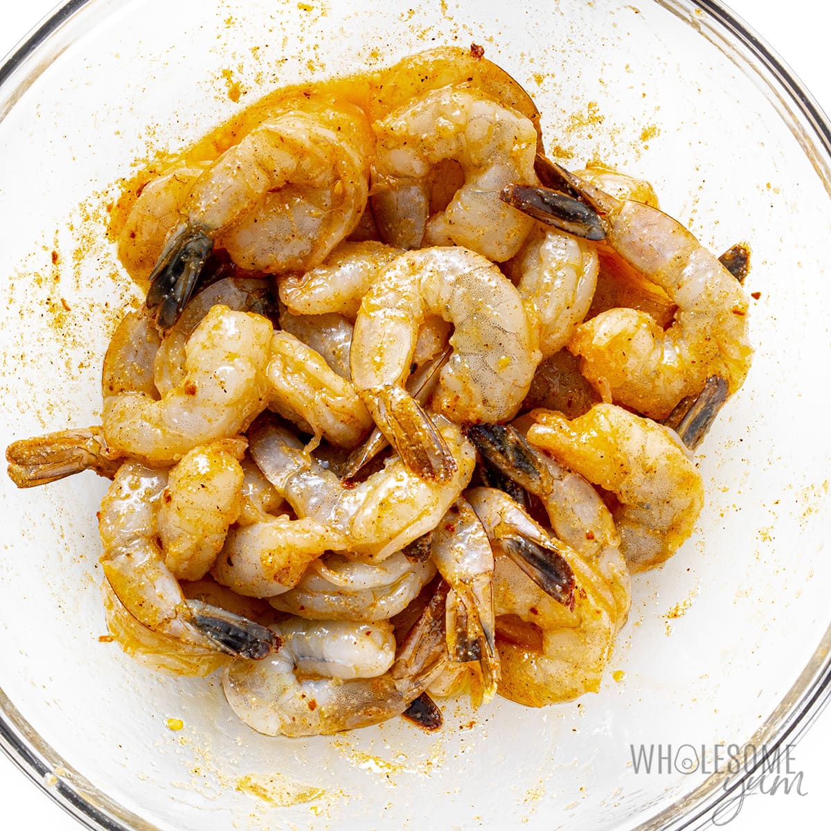 Seafood marinating in a large bowl.