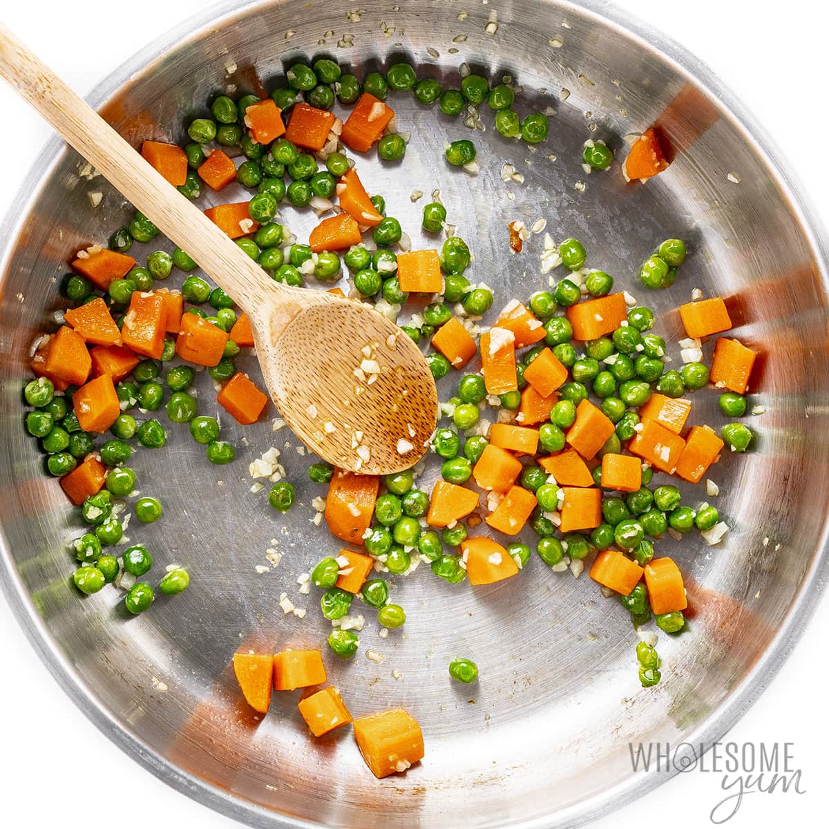 Garlic added to peas and carrots.