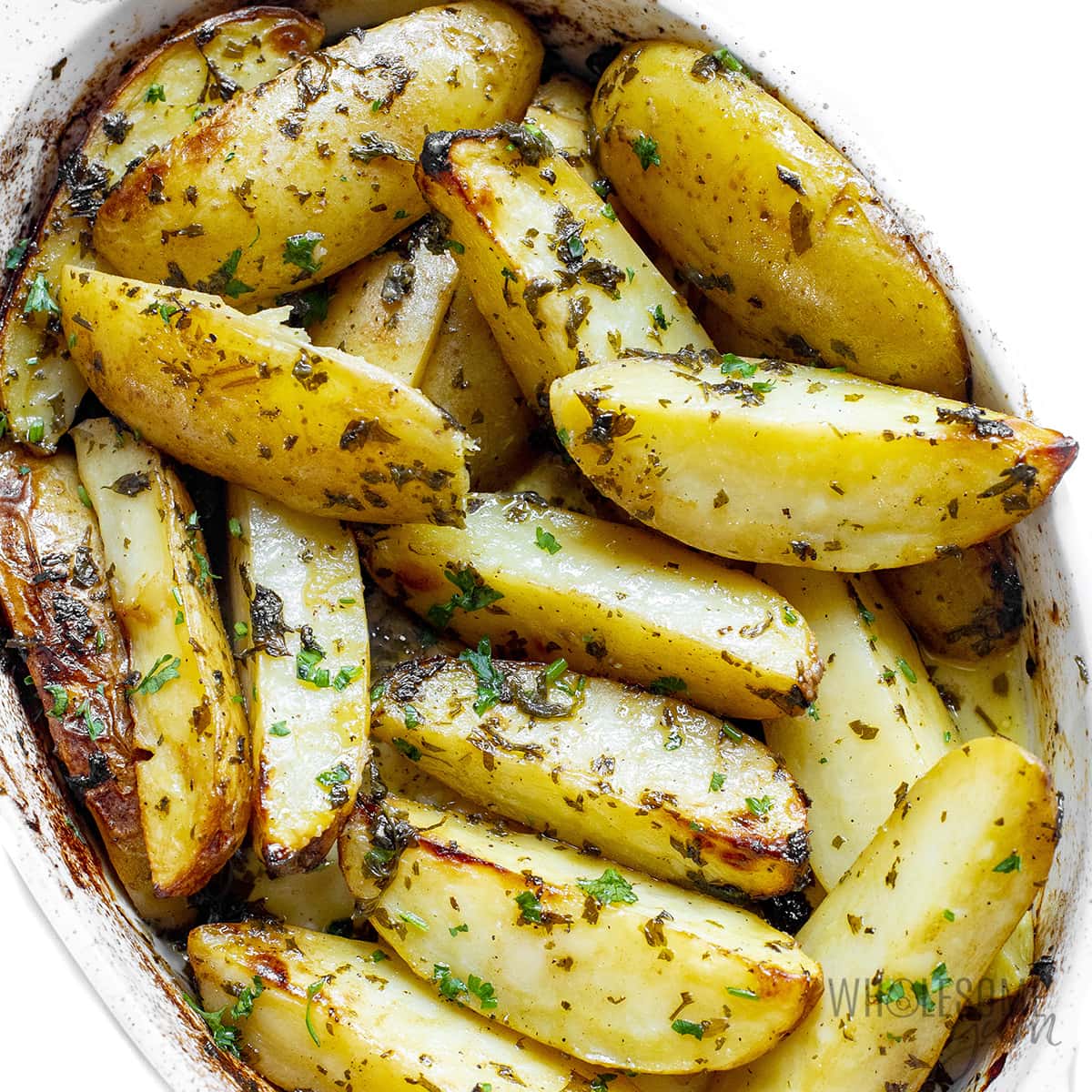 Roasted Greek potatoes in a baking dish.