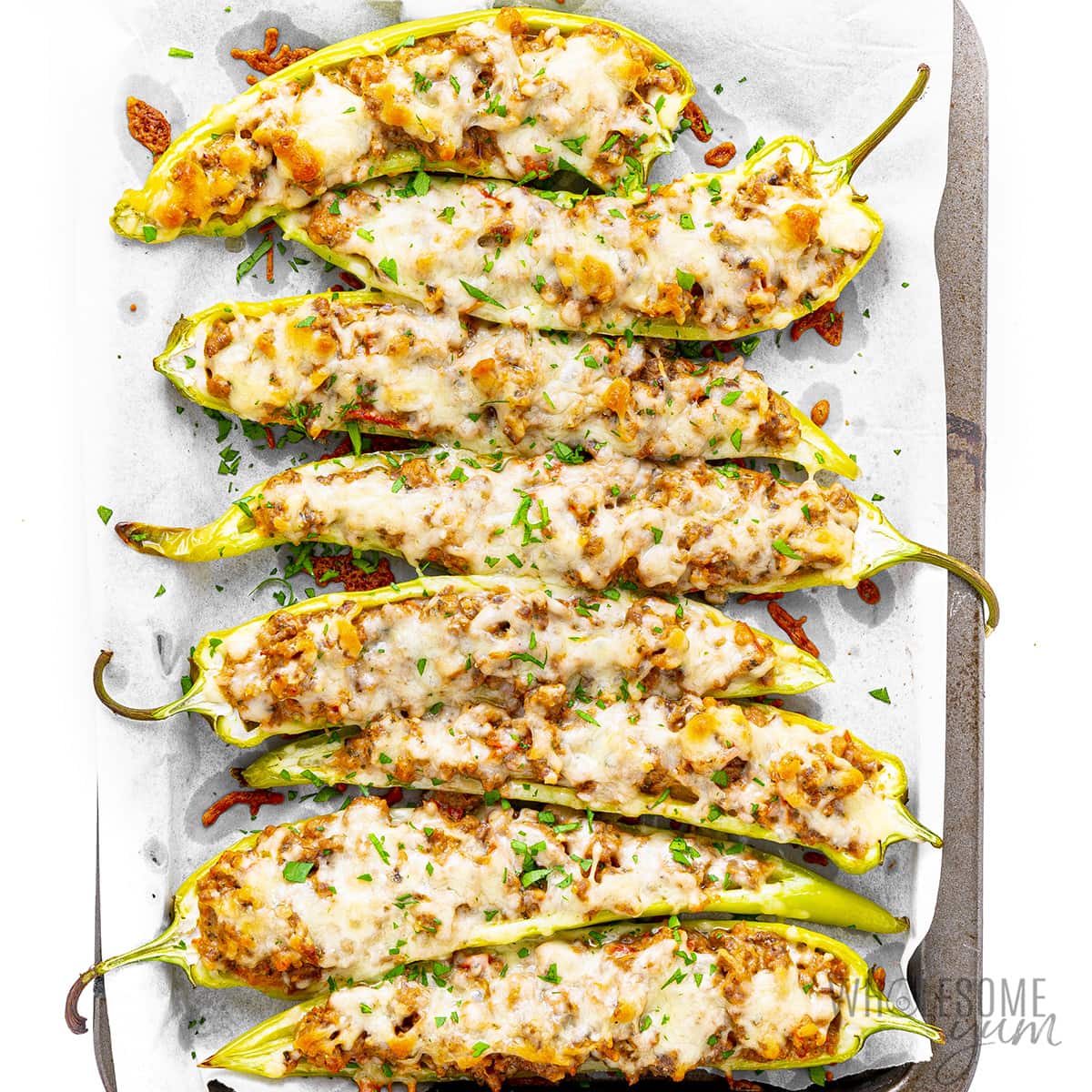 Roast stuffed banana peppers on a griddle.