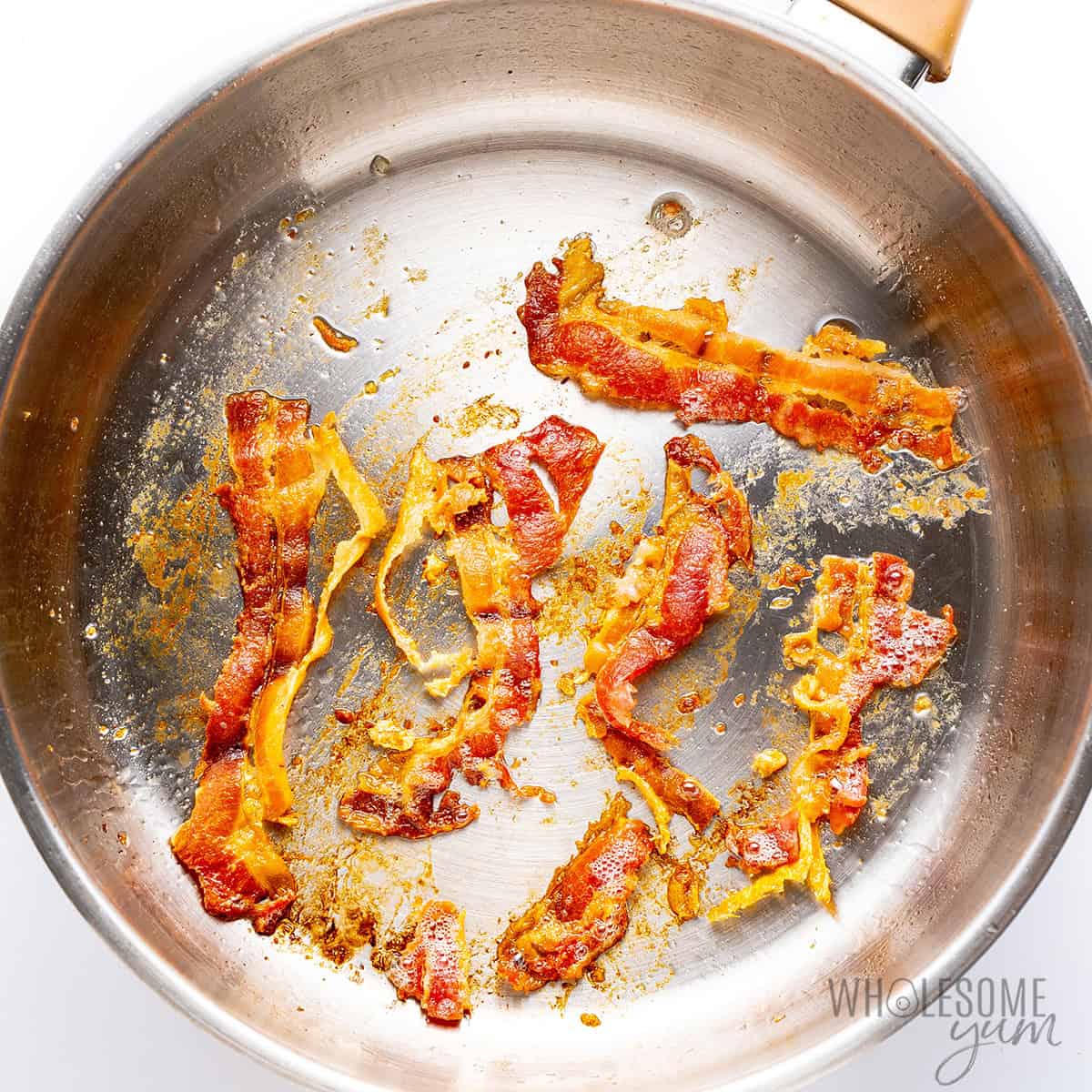 Cooked bacon in a skillet.