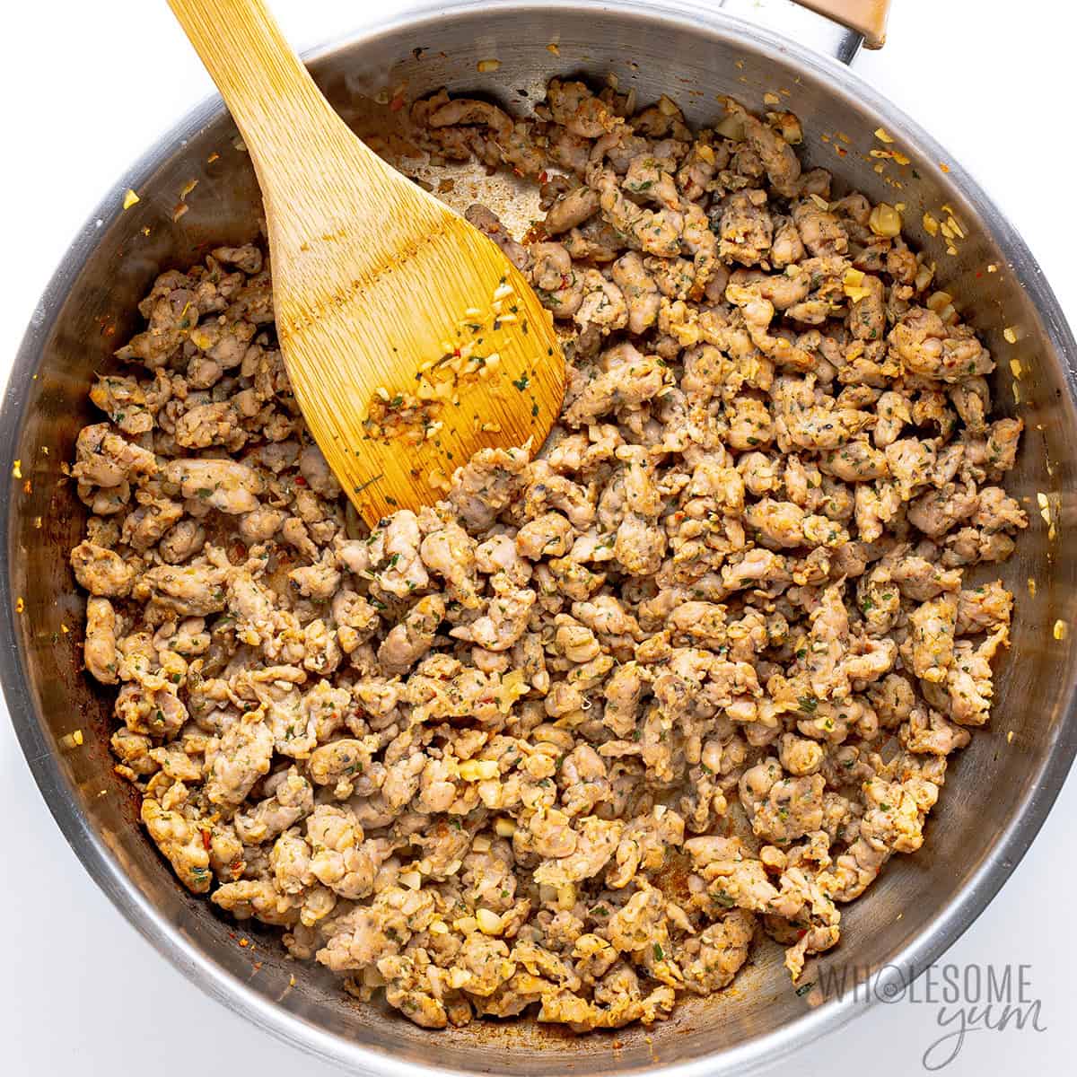 Cooked sausage in a skillet.