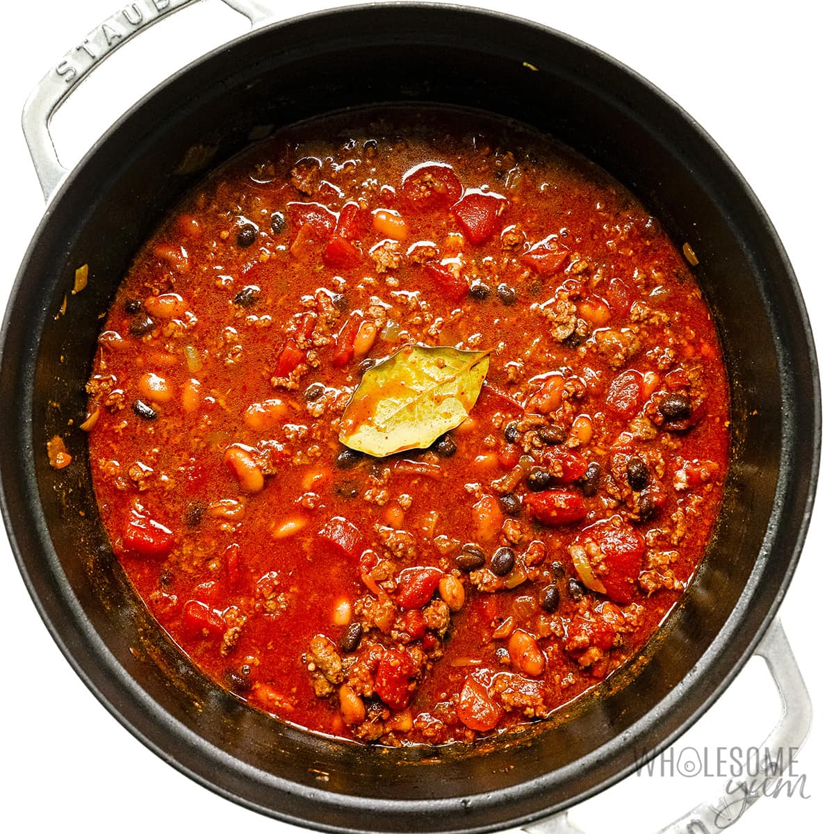 Chili recipe simmering on stovetop. 