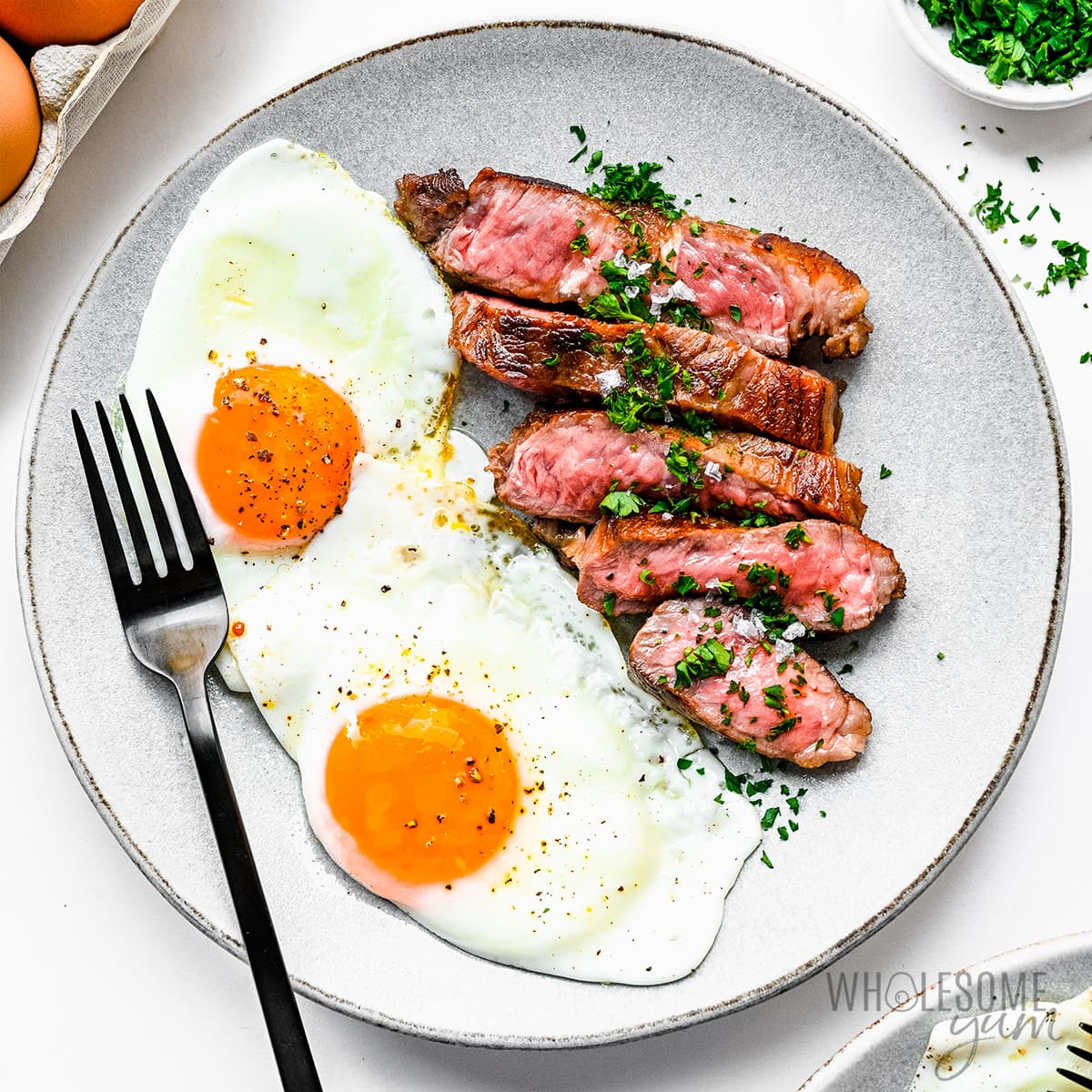 Steak and eggs on a plate.
