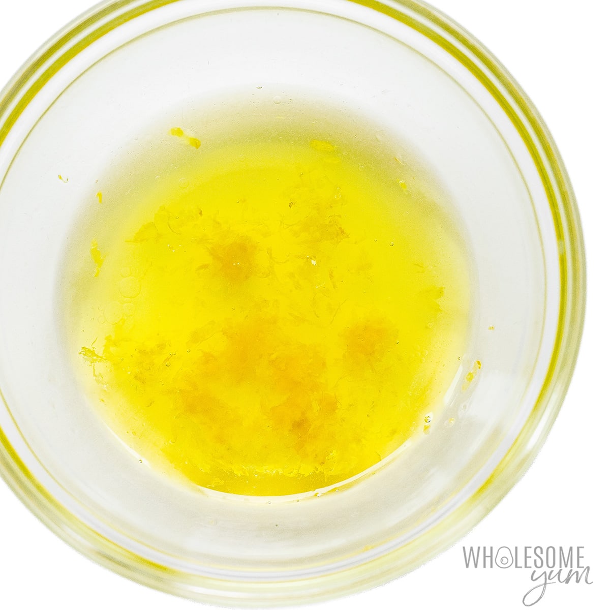 Olive oil, lemon juice, and lemon zest mixed together in small bowl.