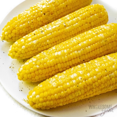 Instant Pot corn on the cob plated with salt and pepper.