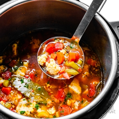 Instant Pot vegetable soup with ladle.