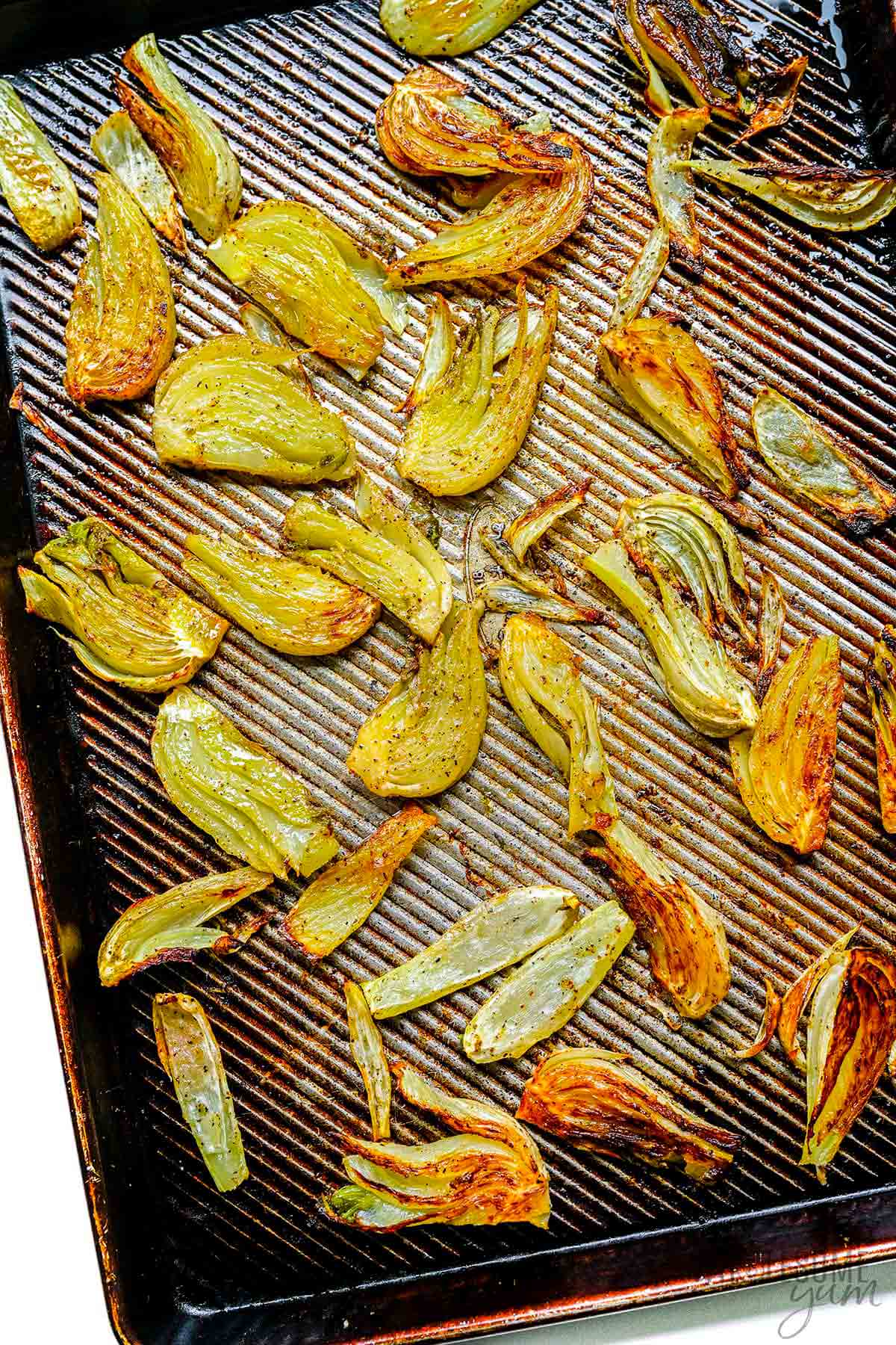 Roasted fennel on a sheet pan.