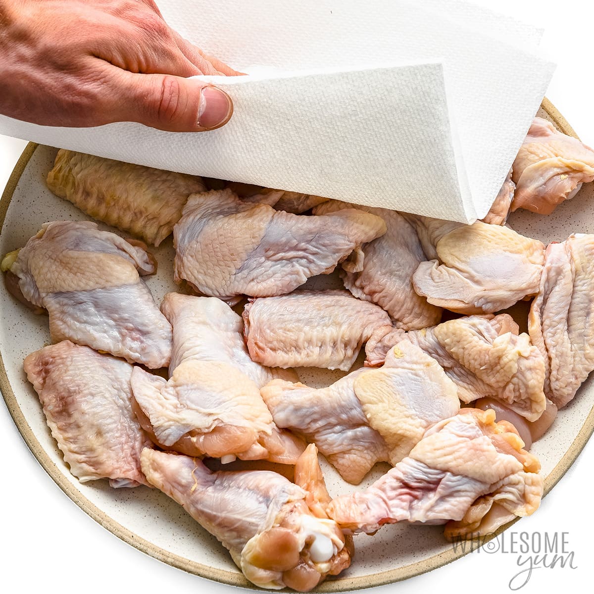 Chicken patted dry with a paper towel.