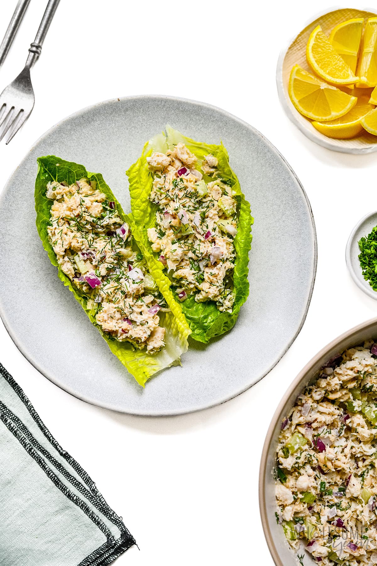 Crab salad spread onto lettuce leaves.