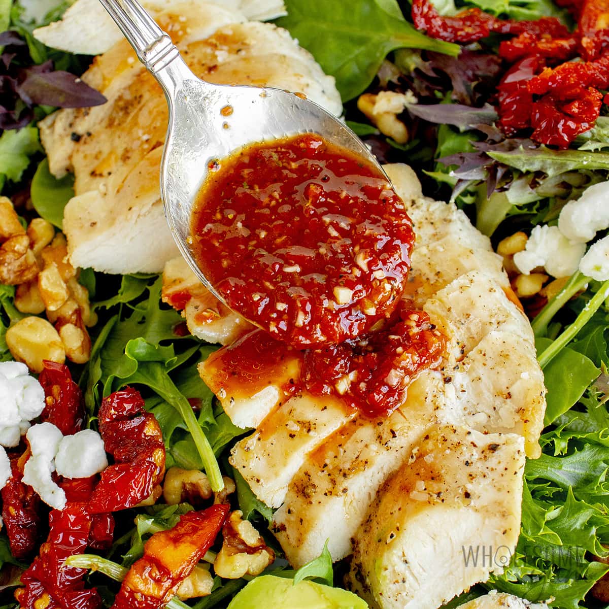 Dressing drizzled over salad. 