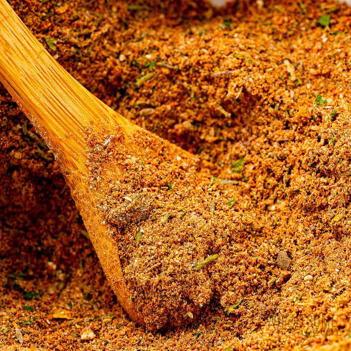 Jerk seasoning close up with a spoon.