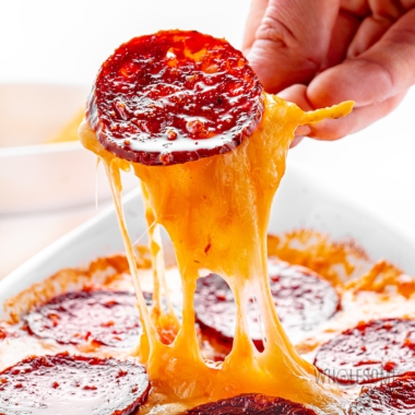 Pizza dip with cheese pull.