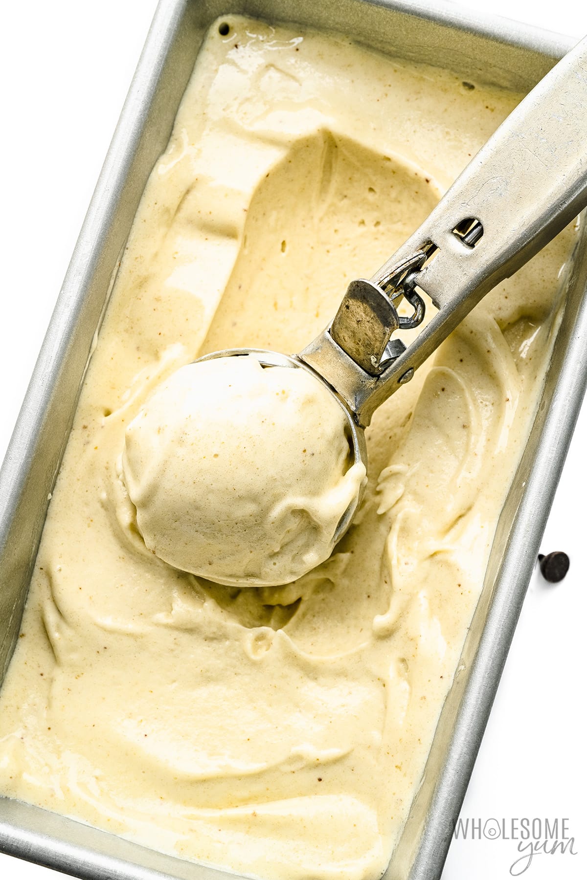 Banana ice cream in an ice cream container.