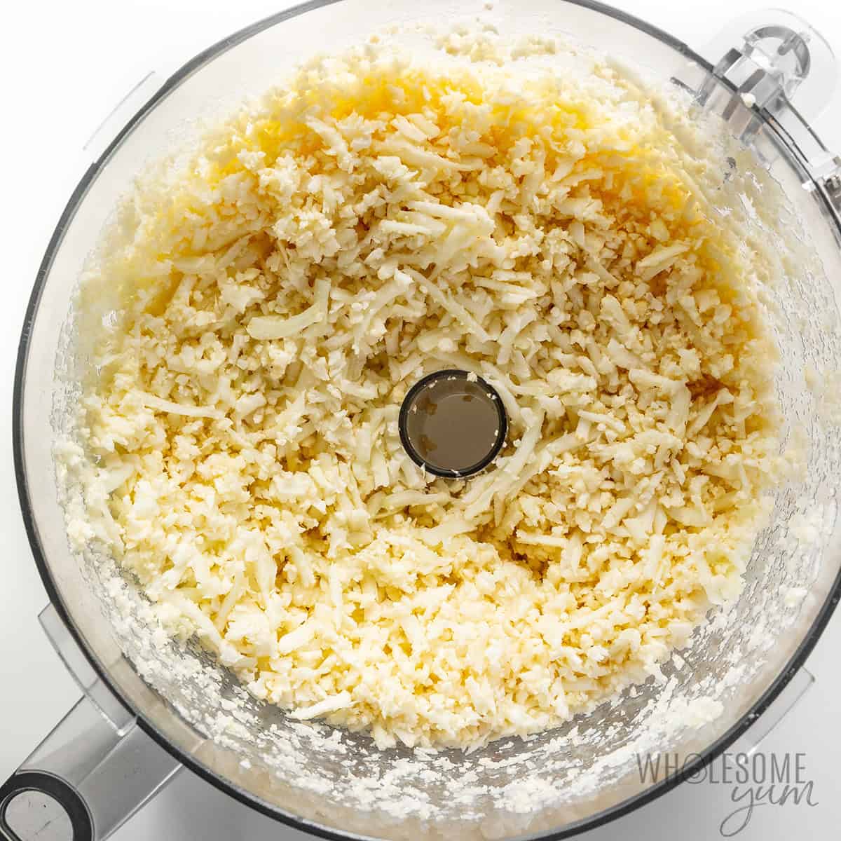 Riced cauliflower in a food processor.