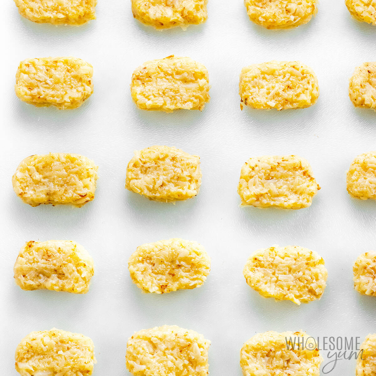 Cauliflower tots on a sheet pan.