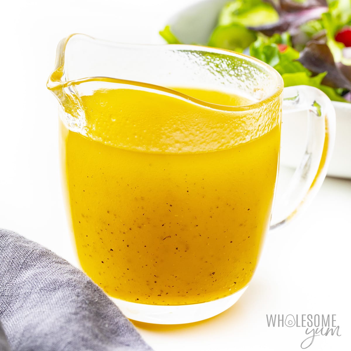 Sugar free salad dressing in small glass pitcher.