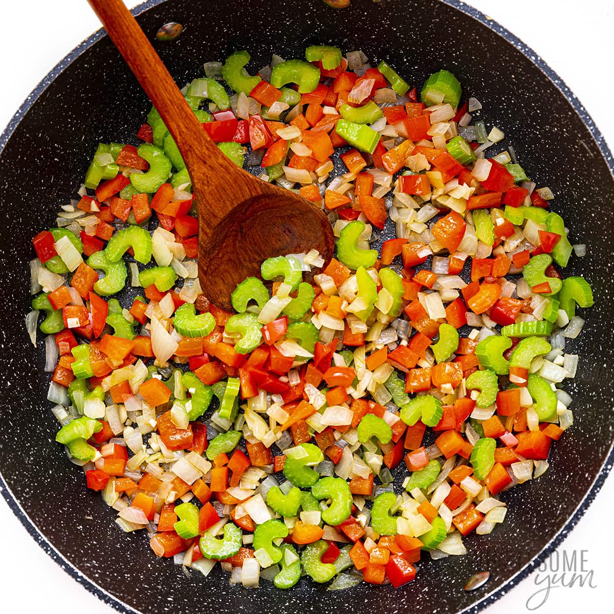  Veggies being sauteed in a skillet.