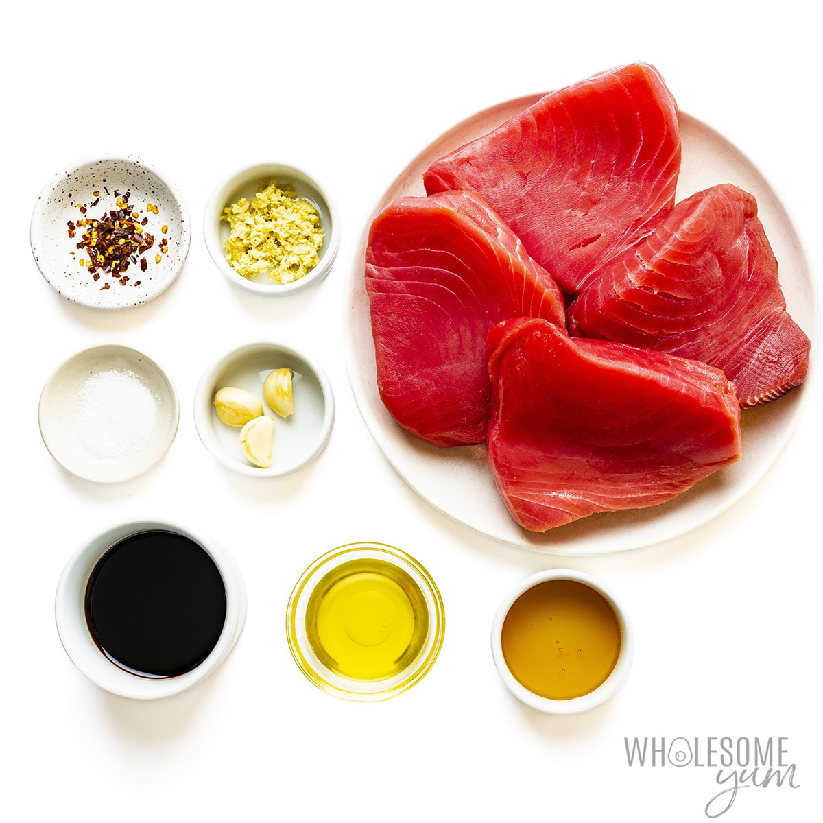 Tuna steak recipe ingredients measured on plates.