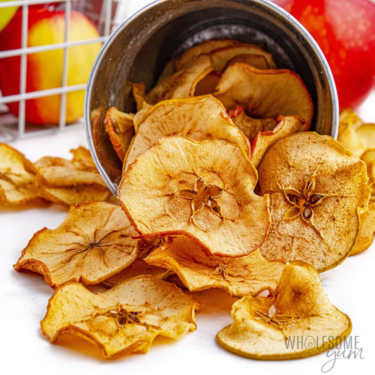 Apple chips spilled out of container.