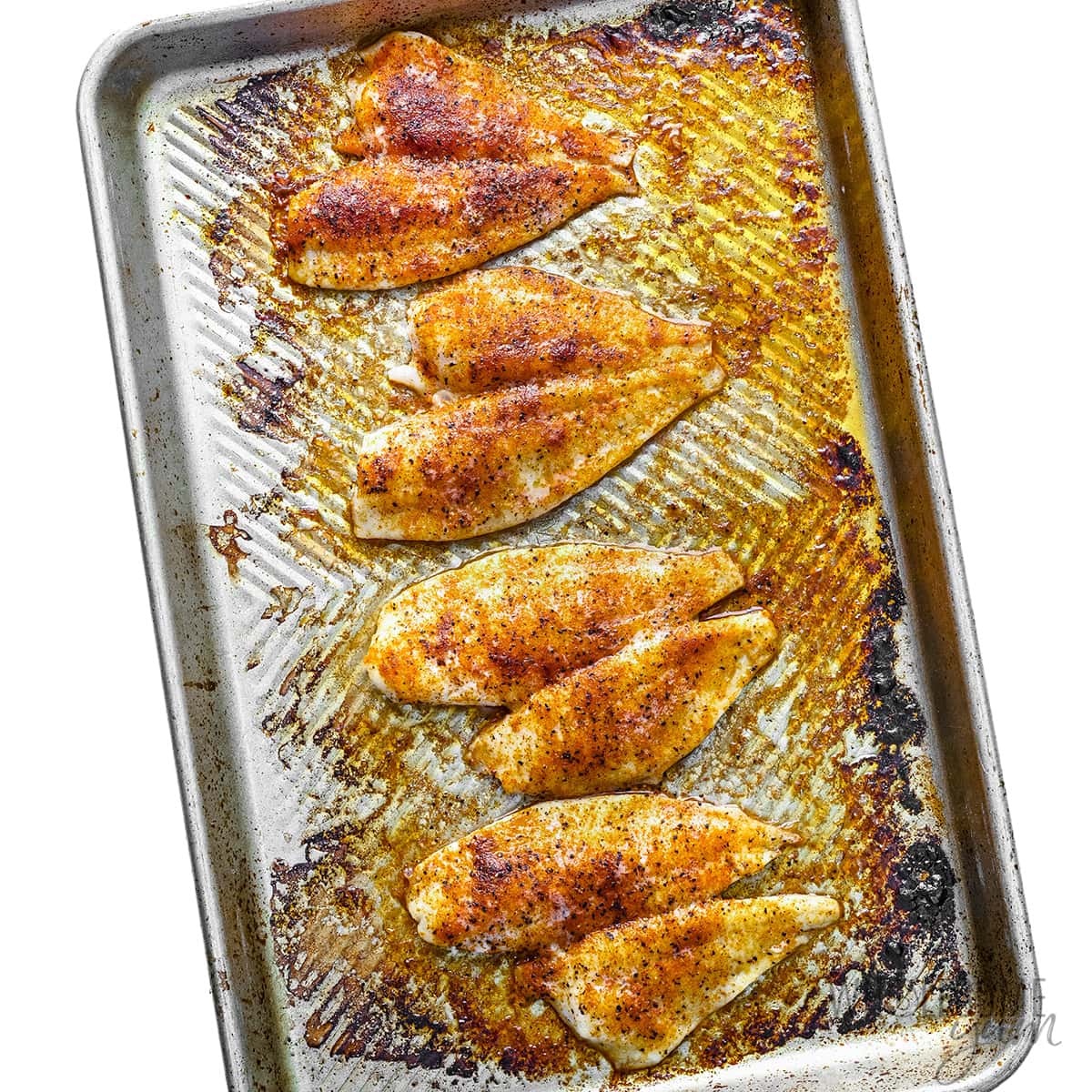 Baked flounder on a sheet pan.