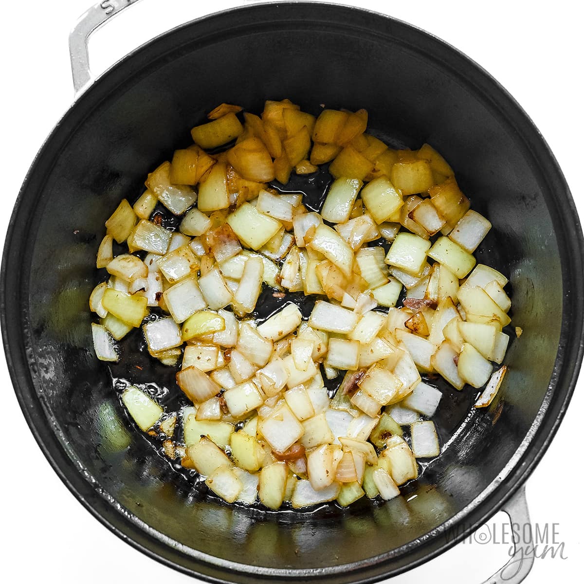 Onions sauteed in Dutch oven.