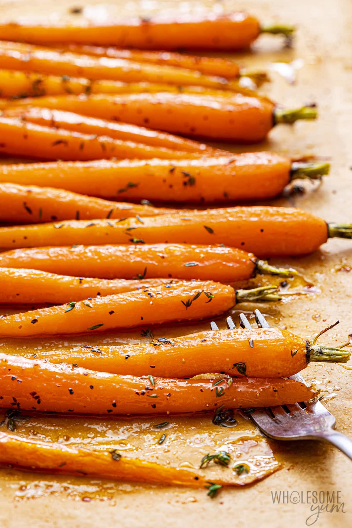 Oven roasted carrots on a sheet pan.