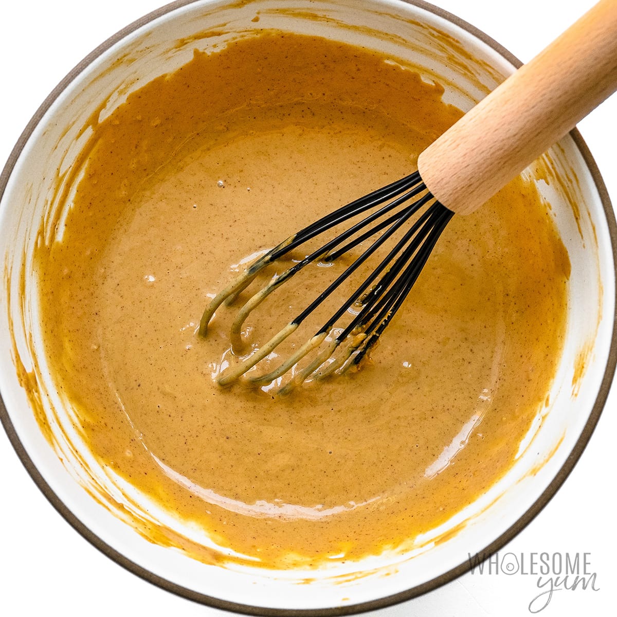 Finished peanut sauce recipe with whisk.