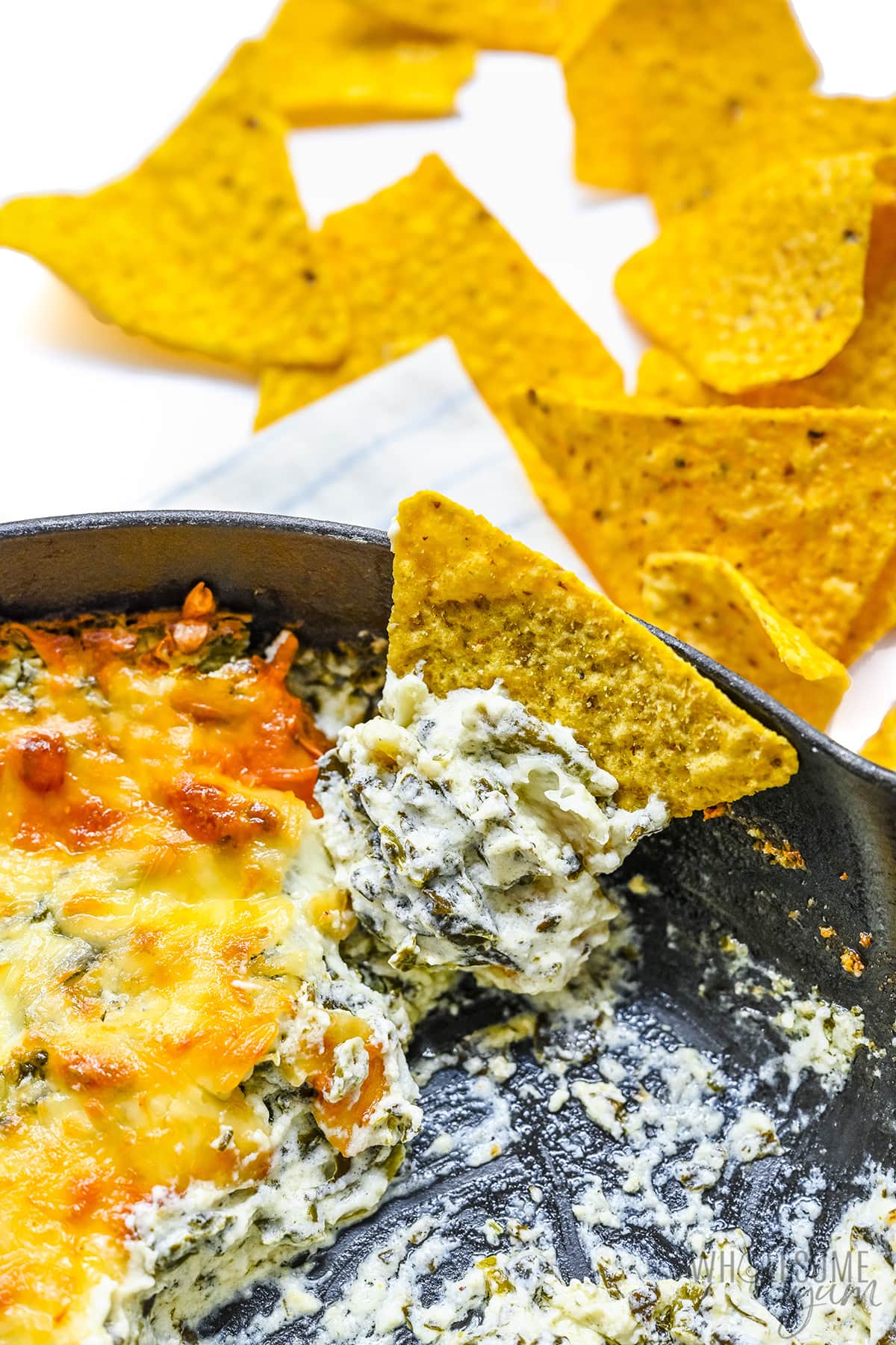 Hot spinach dip up close with a chip.
