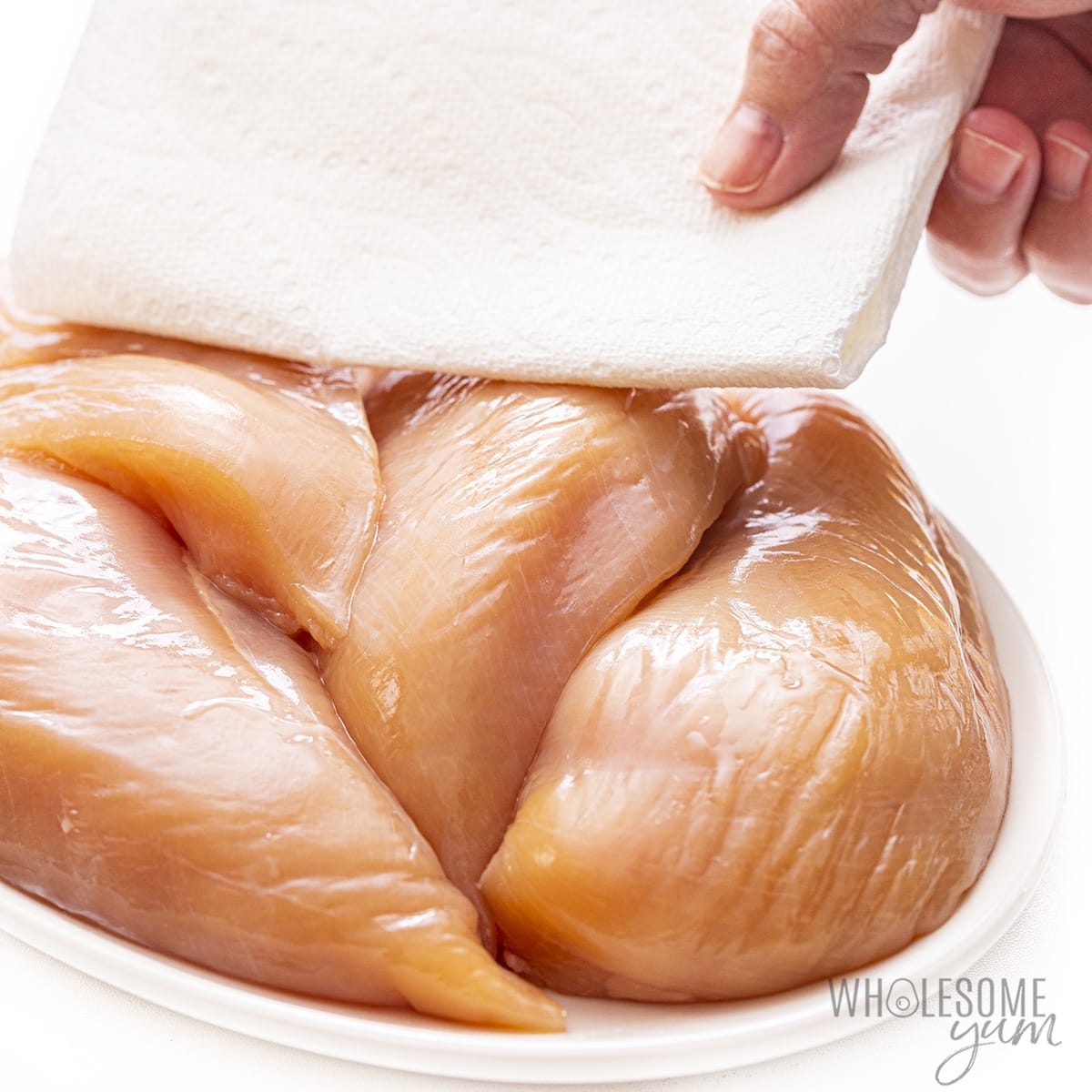 Chicken patted dry with a paper towel.