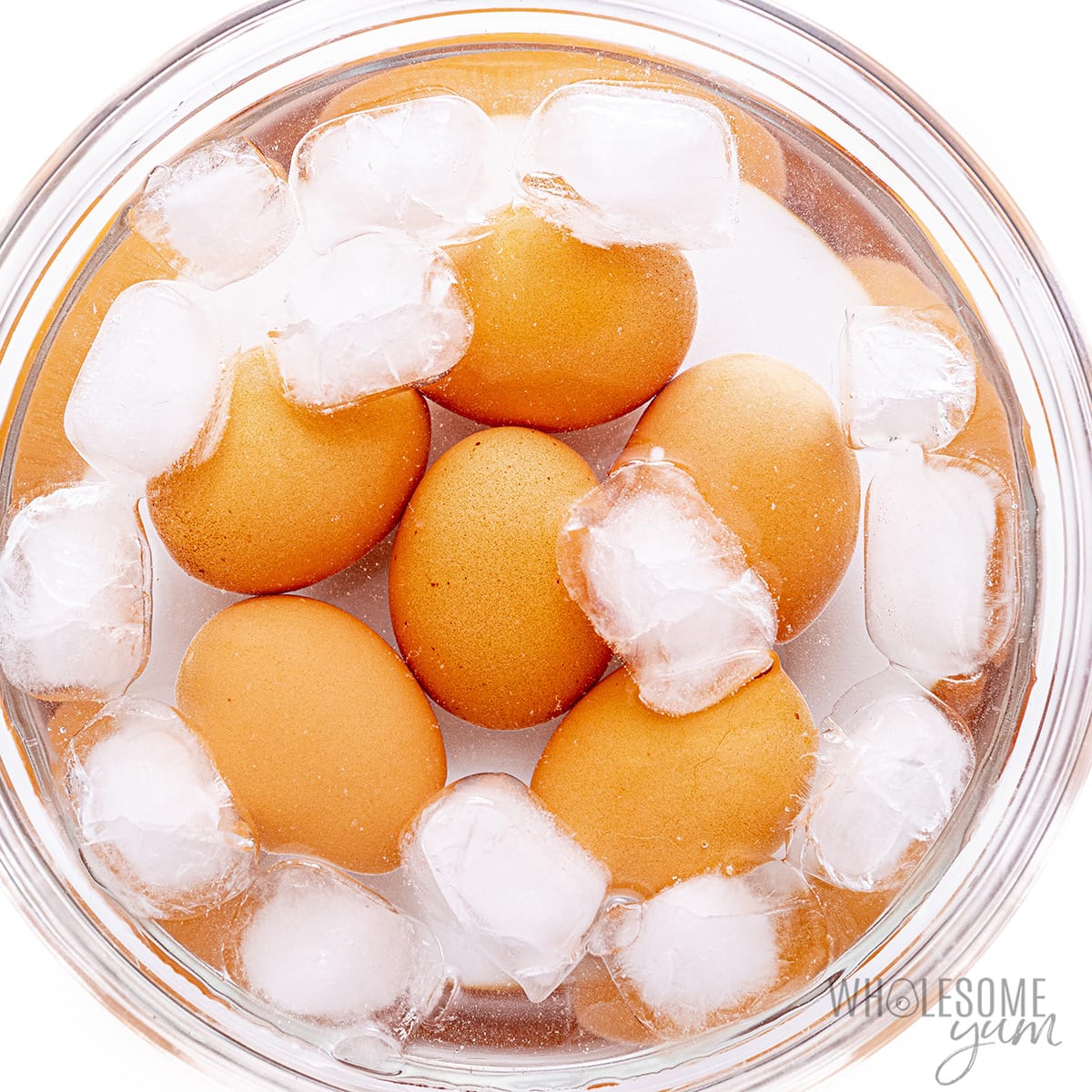 Crack the eggs into a bowl of ice water.