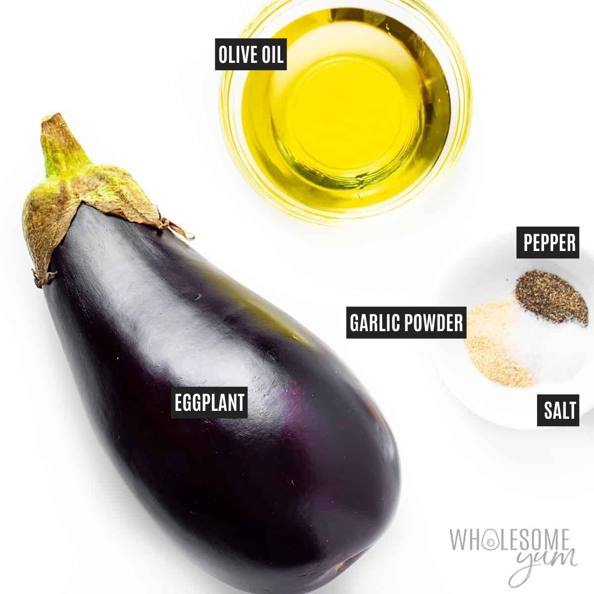 A whole globe eggplant next to labeled bowls of oil and spices.