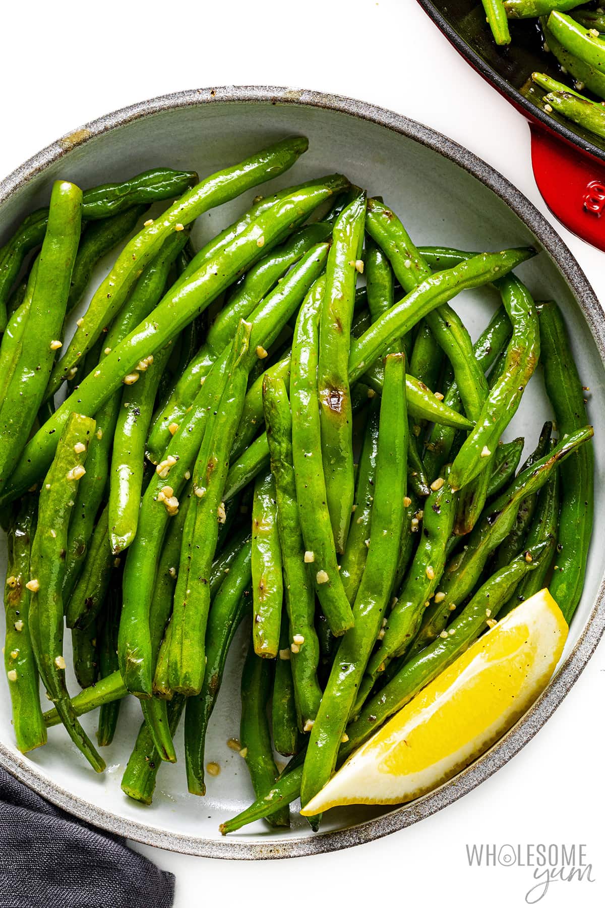 Sauté the green beans in a bowl with the garlic and lemon.