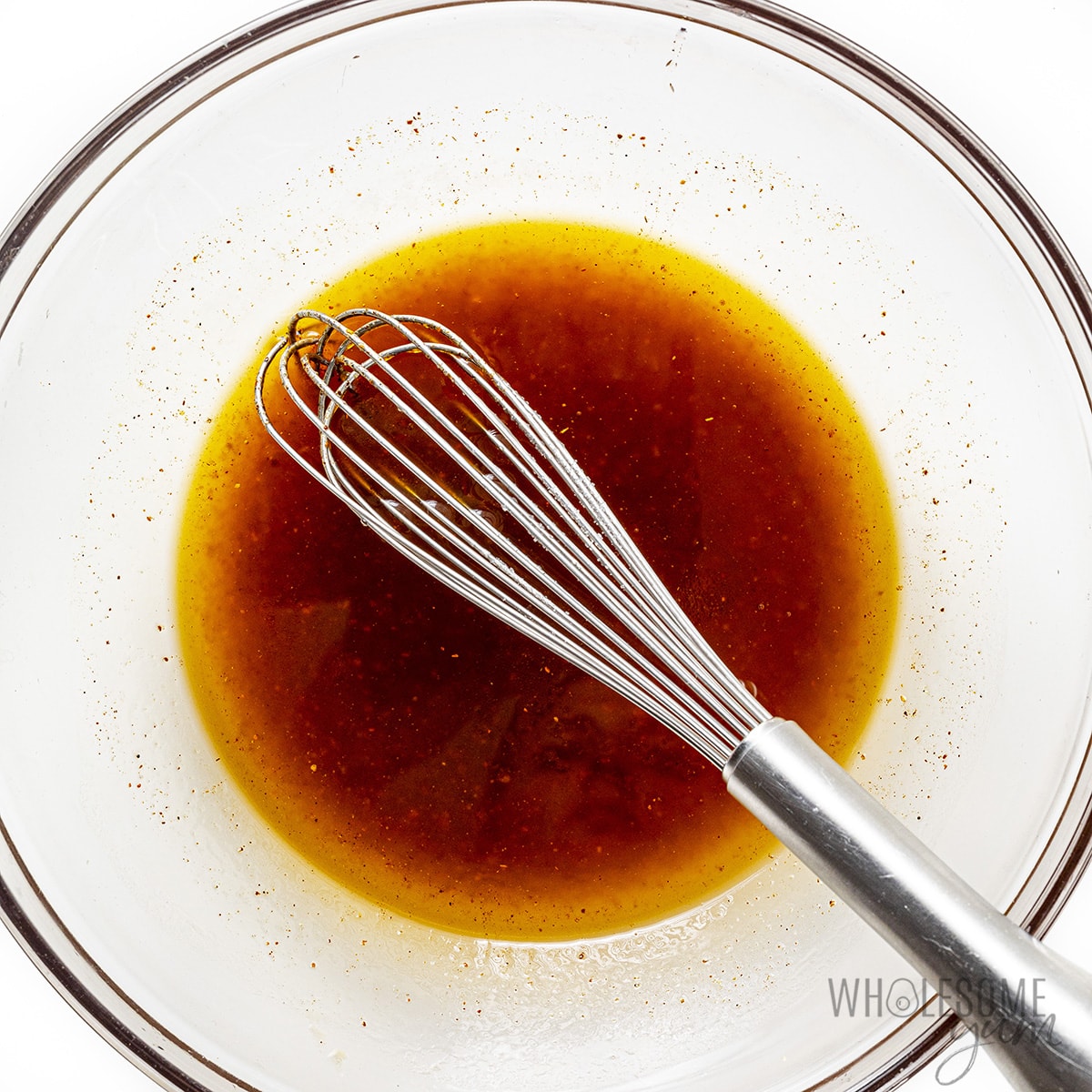 Marinade ingredients whisked together in a bowl.