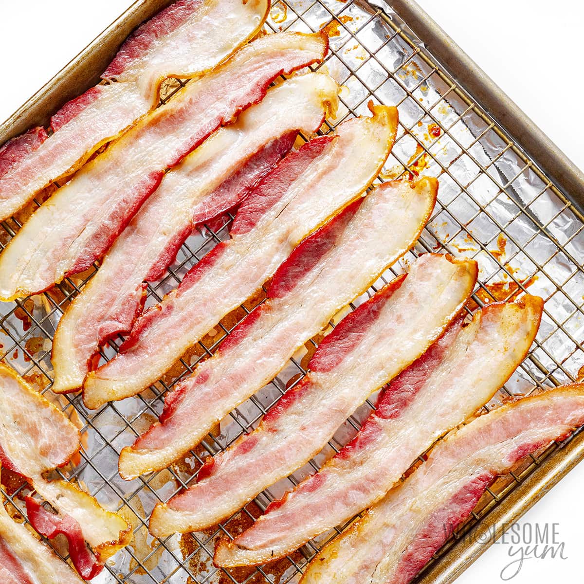 Bacon on a baking sheet with a rack.