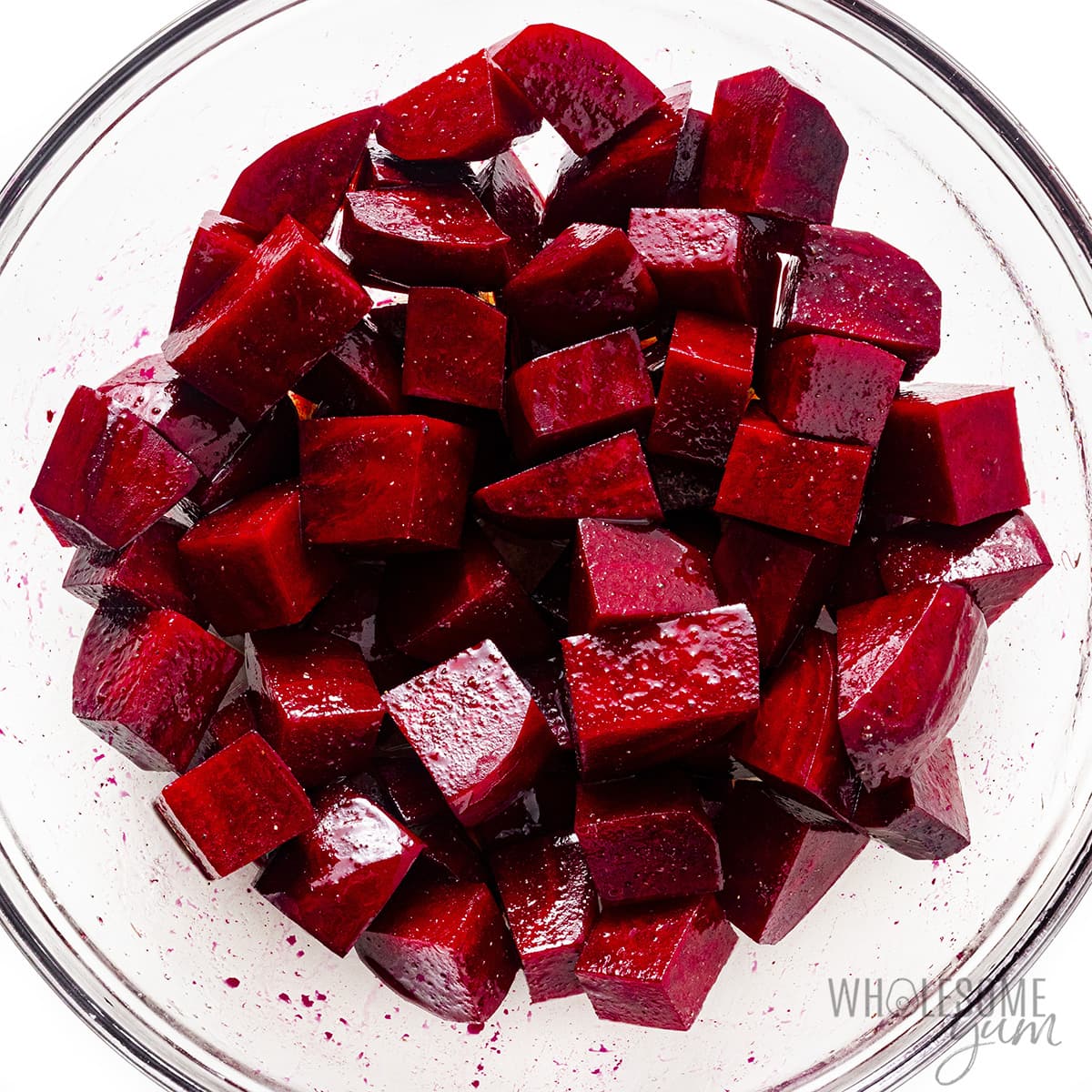Cubed beets seasoned in a bowl.