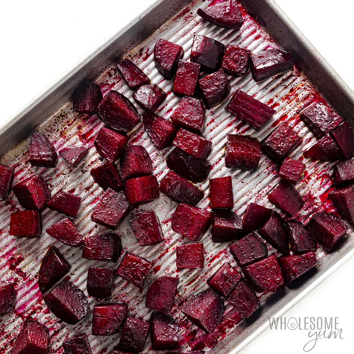 Roasted beets on a baking sheet.