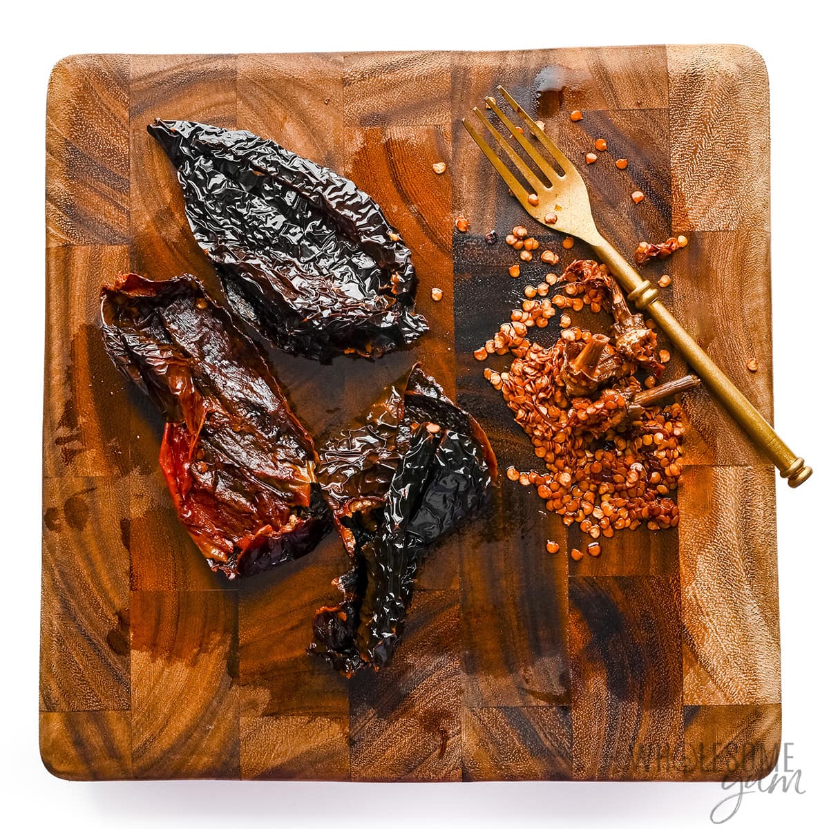 Ancho chiles on a cutting board.