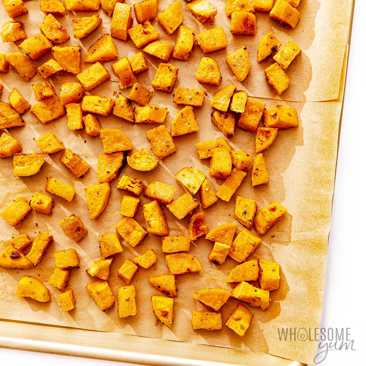 Roasted sweet potatoes on a baking sheet.