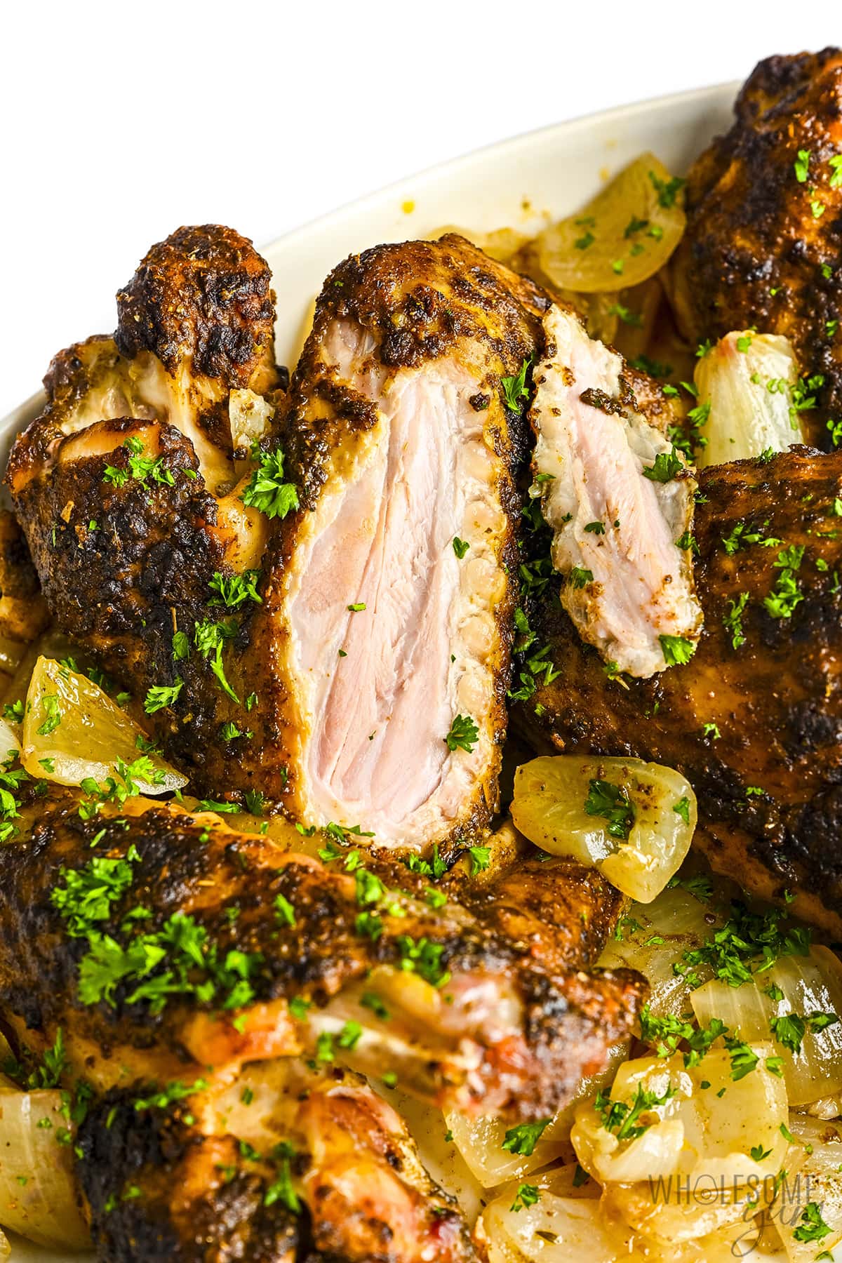 Turkey wings sliced open to show juicy meat.
