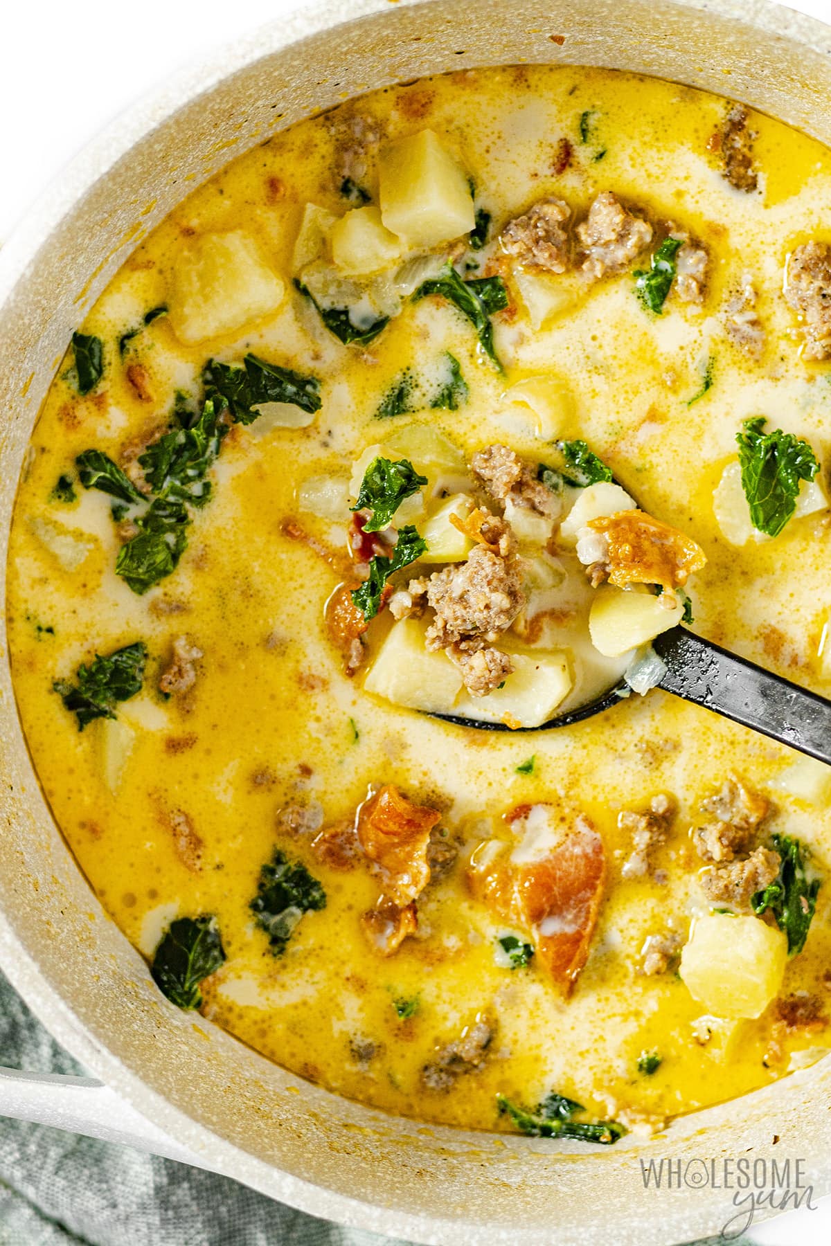 Zuppa Toscana in a bowl with spoon.